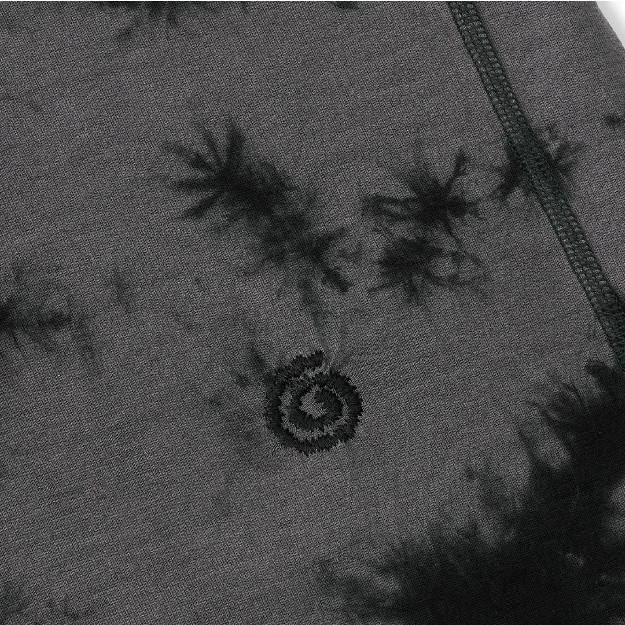 Close-up of a gray fabric with black tie-dye patterns