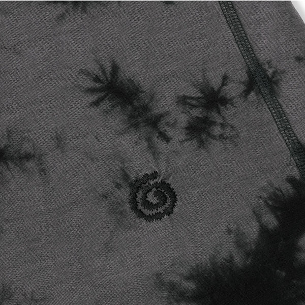 Close-up of a gray fabric with black tie-dye patterns