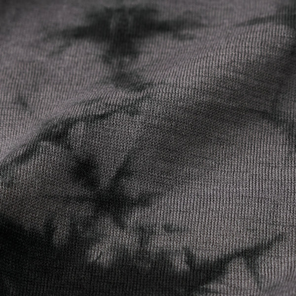 Close-up of dark gray fabric with a subtle pattern