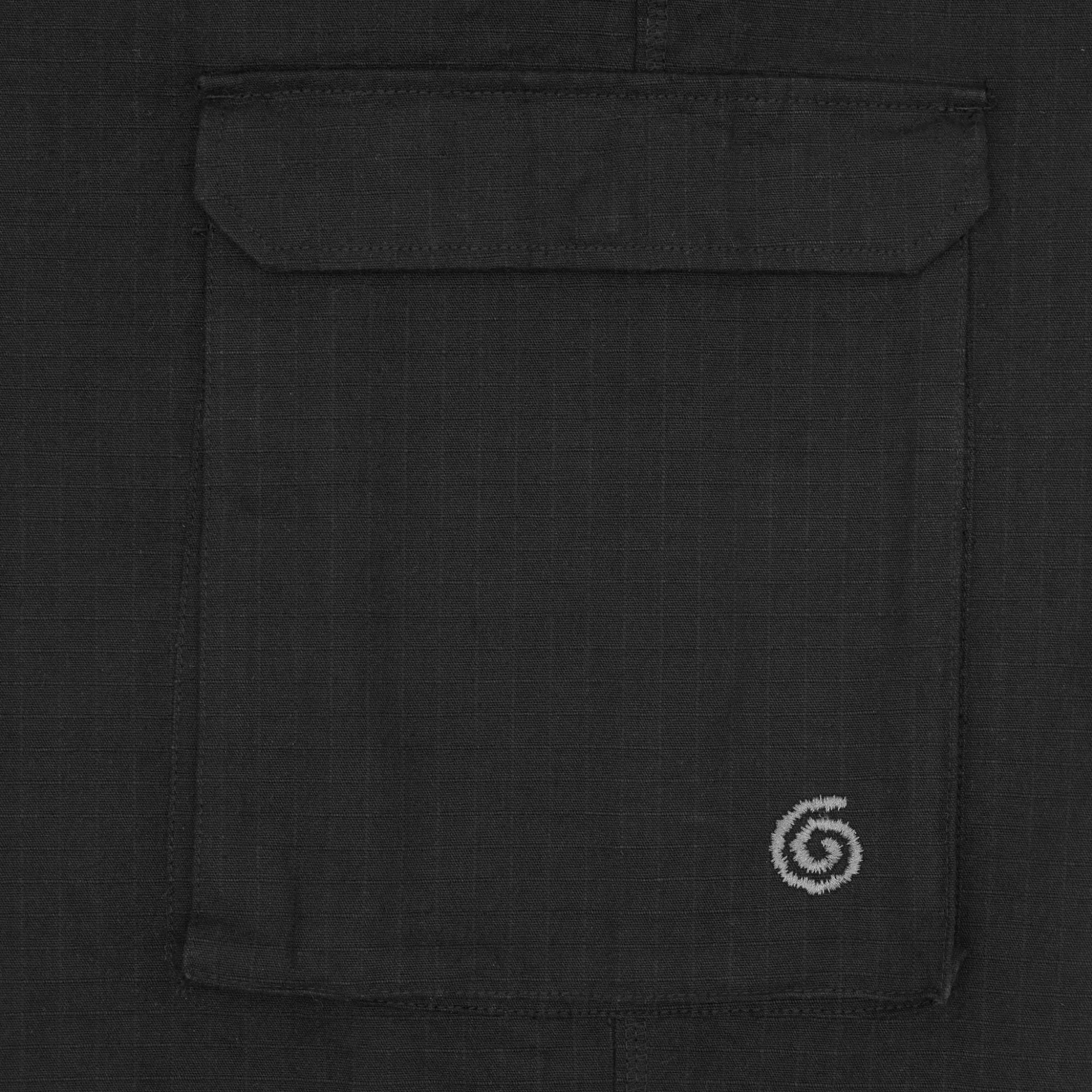 Black pant cargo pocket with a logo on a black background