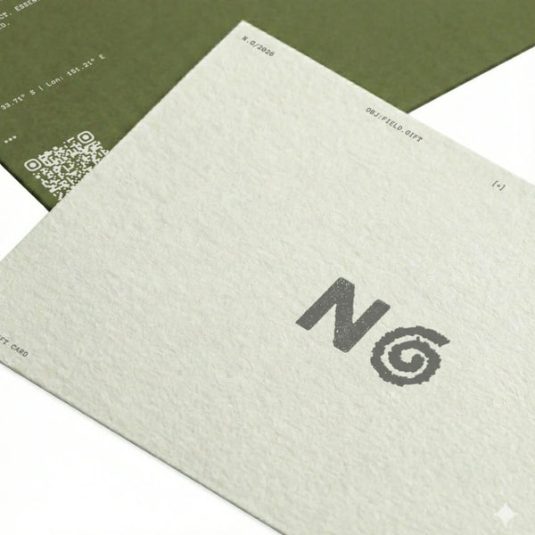 Close-up of a textured card with a logo and QR code on a white background