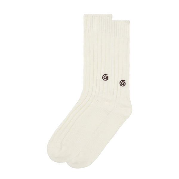 White socks with a small black spiral design on a white background